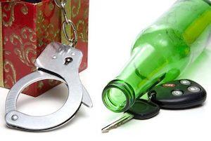 Beer bottle, car keys and handcuffs